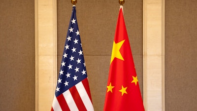 U.S. and Chinese flags are set up at the Diaoyutai State Guesthouse in Beijing, on July 8, 2023.