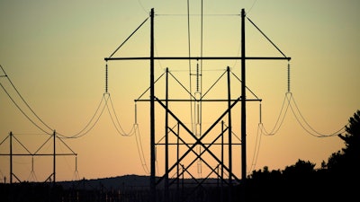 Central Maine Power transmission lines are seen on Oct. 6, 2021, in Pownal, Maine.