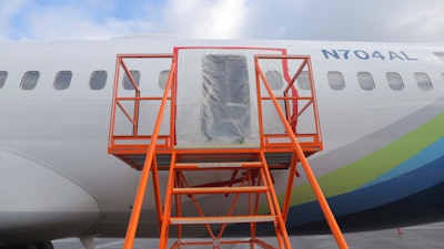 This photo released by the National Transportation Safety Board shows an opening in the fuselage where a door plug fell from Alaska Airlines Flight 1282, on Jan. 7, 2024, in Portland, Ore.