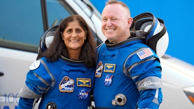 NASA astronauts Suni Williams, left, and Butch Wilmore stand together for a photo enroute to the launch pad at Space Launch Complex 41 Wednesday, June 5, 2024, in Cape Canaveral, Fla., for their liftoff on the Boeing Starliner capsule to the international space station.