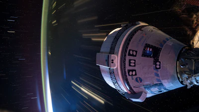 In this long-exposure photo provided by NASA, Boeing's Starliner spacecraft is docked to the Harmony module of the International Space Station on July 3, 2024.
