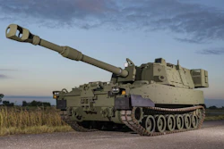 Green M109A7 Self-Propelled Howitzer on a gravel road.