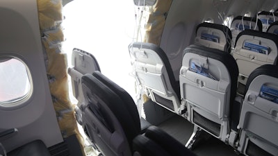 This image taken Sunday, Jan. 7, 2024, and released by the National Transportation Safety Board, shows the section of a a Boeing 737 Max where a door plug fell while Alaska Airlines Flight 1282 was in flight.
