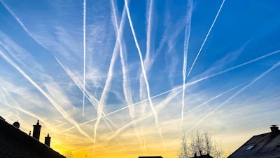 Plane contrails in the sky.
