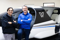 Whisper Head of Flight Sciences Vineet Ahuja, left, and Whisper Co-founder and CEO Mark Moore are standing in front of the Whisper Jet cabin prototype.