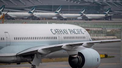 A Cathay Pacific airplane taxis at Hong Kong International Airport in Hong Kong.