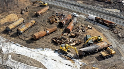Cleanup continues, Feb. 24, 2023, at the site of a Norfolk Southern freight train derailment that happened on Feb. 3 in East Palestine, Ohio.
