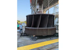 ORNL’s Jay Tiley inspects a hydroelectric runner from TVA’s Cherokee Dam. ORNL is partnering with TVA and others to develop a process to produce large metal components like this for clean energy applications.