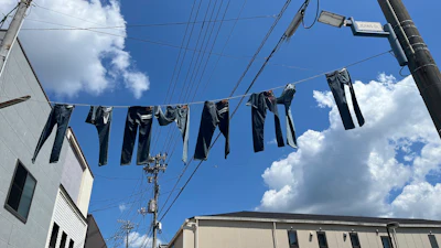 Pairs of jeans flap over Jeans Street in Kojima, Okayama prefecture, Japan, on Sept. 4, 2024.