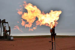 A flare burns natural gas at an oil well in Watford City, N.D.