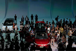 Attendees take a close look at the Volkswagen ID.7 Vizzion, a new electric flagship sedan during a world premiere on the eve of the Auto Shanghai 2023 show in Shanghai, China, April 17, 2023.