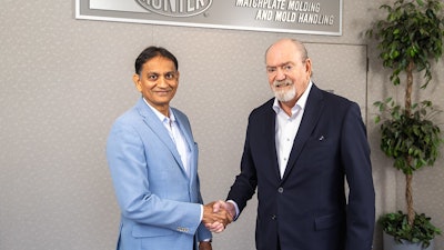 Bill Hunter (right) and Manny Gandhi finalized the SMG Group’s acquisition of Hunter Foundry Machinery Corporation on July 24, 2024 at Hunter headquarters in Schaumburg, Illinois, near Chicago.