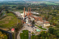 A brief patch of early morning sunlight brightens the landscape around the Greenidge Generation power plant, Oct. 15, 2021, in Dresden, N.Y.