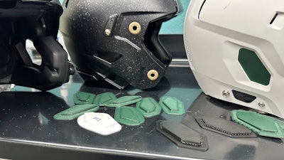 A 3D printer creates helmet inserts at Michigan State University's Biomechanical Design Research Laboratory, Monday, Nov. 18, 2024, in East Lansing, Mich.