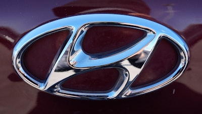 The Hyundai logo is seen at a new and used vehicles dealership in Palatine, Ill., March 20, 2024.