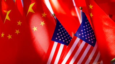 American flags are displayed with Chinese flags on top of a trishaw on Sept. 16, 2018, in Beijing.