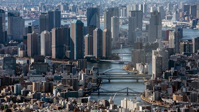 An aerial view of the skyscrapers and the densely packed buildings are seen on Jan. 29, 2021, from an observation deck in Tokyo.