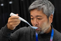 Kiyohiro Izumo uses the Kirin Electric Salt spoon which intensifies salt flavor by flowing a mild electric current through the food around the tongue to attract salt towards the tongue, during 2025 CES Unveiled, Sunday, Jan. 5, 2025, in Las Vegas.