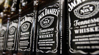 Bottles of Jack Daniel's Tennessee Whiskey line the shelves of a liquor outlet in Montpelier, Vt., Dec. 5, 2011.
