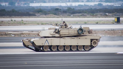 Military tank M1 Abrams in action at an airfield in San Diego, CA.