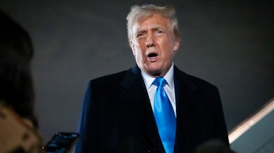 President Donald Trump speaks to reporters next to Air Force One after arriving back at Joint Base Andrews, Md., Sunday, Feb. 2, 2025.