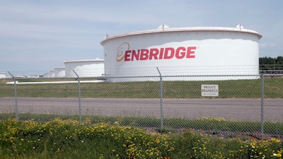 The corporate name stands out on tanks shown Friday, June 29, 2018 at at the Superior terminal of Enbridge Energy in Superior, Wis.