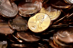Freshly-made pennies sit in a bin at the U.S. Mint in Denver on Aug. 15, 2007.
