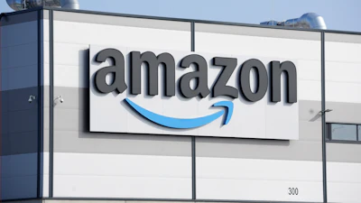 An Amazon company logo marks the facade of a building, March 18, 2022, in Schoenefeld near Berlin.