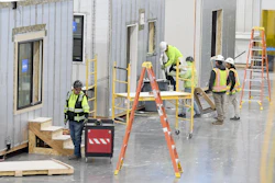 Workers construct modular homes at the Fading West factory in Buena Vista, Colo., on Feb. 19, 2025.