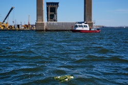 A wreath laid by family members of the victims who died during the collapse of the Francis Scott Key Bridge in Baltimore float in the Chesapeake Bay, March 25, 2025.