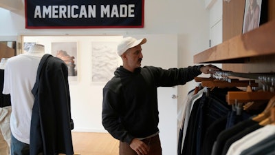 Javid Moghaddasnia, director of customer engagement, discusses American Giant clothing at the company's showroom in San Francisco, April 17, 2025.