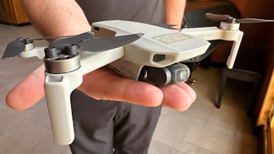 Seth Simonson, assistant professor and UAS curriculum lead for the North Dakota State College of Science, holds a Chinese-manufactured drone used in class, on Jan. 15, 2025, at the state Capitol in Bismarck, N.D.