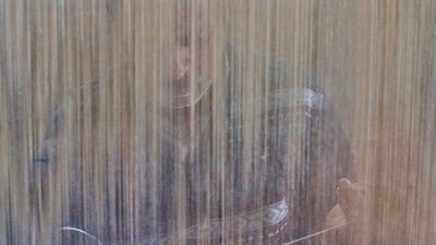 Mohammad Yousaf Dar weaves a Kashmiri hand-knotted carpet at his home in Srinagar, Indian controlled Kashmir, on April 12, 2025.