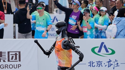 The Sky Project Ultra robot also known as Tien Kung Ultra crosses the finish line to win the Humanoid Robot Half-Marathon held in Beijing on Saturday, April 19, 2025.