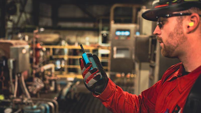 A frontline worker uses the Walt Smart Radio System.