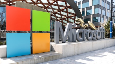 A Microsoft sign and logo are pictured at the company's headquarters, Friday, April 4, 2025, in Redmond, Wash.