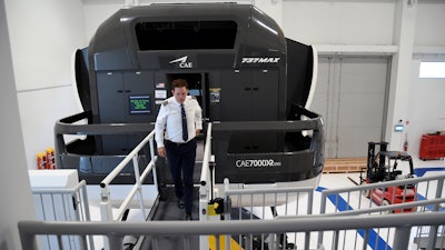Capt. Miles Morgan, managing director of flight training for United Airlines, exits a simulator at the company's training campus in Denver, Friday, May 16, 2025.
