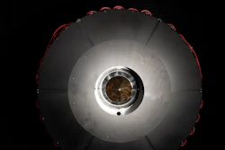 In the optical power beaming receiver designed for PRAD, the laser enters the center aperture, strikes a parabolic mirror, and reflects onto dozens of photovoltaic cells arranged around the inside of the device which convert the energy back to usable power.