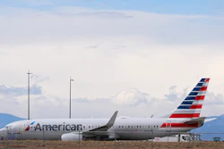 An American Airlines jetliner that caught fire after landing the previous day at Denver International Airport sits near a hangar at the airport, March 14, 2025, in Denver.