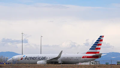 An American Airlines jetliner that caught fire after landing the previous day at Denver International Airport sits near a hangar at the airport, March 14, 2025, in Denver.