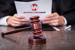Legal document with ManufacturingNow logo and wooden gavel on professional desk
