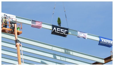 Construction crews prepare to mount the final structural steel beam on the 1.6 million-square-foot AESC gigafactory being constructed in the Kentucky Transpark in Bowling Green, Ky., during the facility's 'Topping Out' structural completion milestone ceremony on Thursday, Sept. 14, 2023.