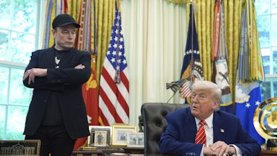 President Donald Trump, right, speaks during a news conference with Elon Musk in the Oval Office of the White House, Friday, May 30, 2025, in Washington.