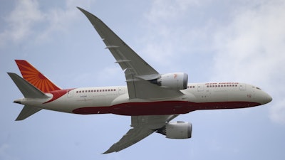 An Air India Boeing 787 Dreamliner performs its demonstration flight during the 50th Paris Air Show at Le Bourget airport, north of Paris, on June 18, 2013.