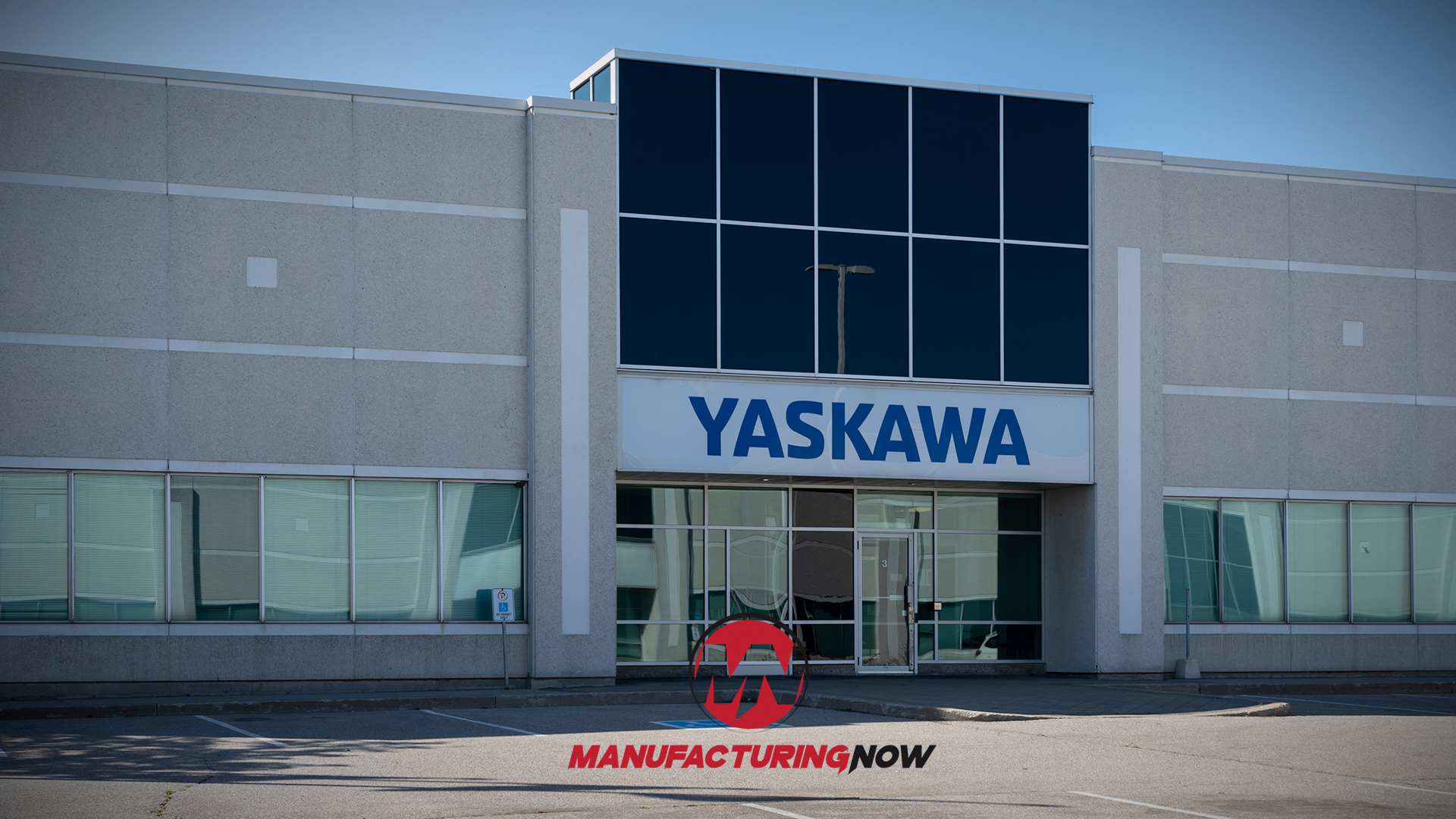 Yaskawa manufacturing facility exterior with modern glass and concrete design