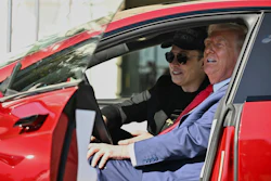 President Donald Trump and Tesla CEO Elon Musk speak to reporters as they sit in a red Model S Tesla vehicle on the South Lawn of the White House, March 11, 2025, in Washington.