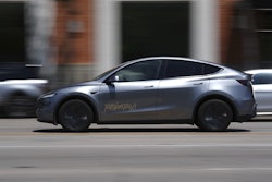 A driverless Tesla robotaxi, a ride-booking service, moves through traffic, Sunday, June 22, 2025, in Austin, Texas.