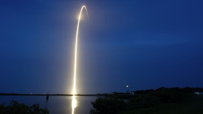 In this long exposure photo, a SpaceX Falcon 9 rocket with a payload of Starlink V2 Mini internet satellites lifts off from Launch Complex 40 at the Cape Canaveral Space Force Station in Cape Canaveral, Fla., late Sunday, July 23, 2023.