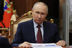 Russian President Vladimir Putin listens to Russian Academy of Sciences President Gennady Krasnikov during their meeting at the Kremlin in Moscow, Russia, Tuesday, July 15, 2025.