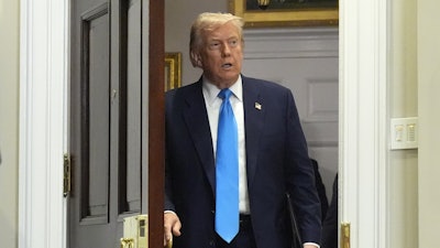 President Trump arrives in the Roosevelt Room at the White House, July 30, 2025.